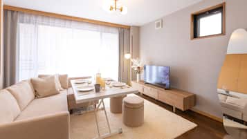 Deluxe House | Living area | Flat-screen TV