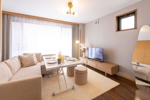 Deluxe House | Living area | Flat-screen TV