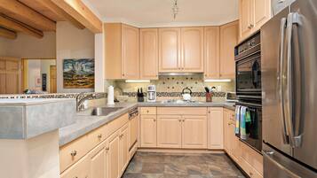 2 Bedroom Condo 150 | Private kitchen | Full-size fridge, microwave, oven, stovetop