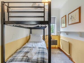 A bunk bed room with a checkered bedspread, a rolled towel, and a radiator. - Perfect for family and friends get togethers to enjoy coast and countryside. (Walpole St Peter, near King&rsquo;s Lynn)