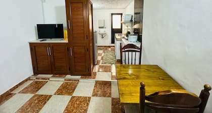 studio with 1 double bed, private bathroom with warm shower,free parking & wifi.