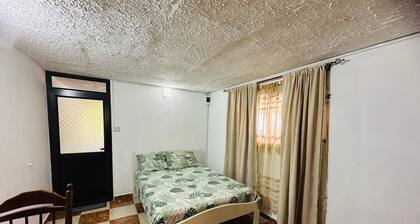 studio with 1 double bed, private bathroom with warm shower,free parking & wifi.