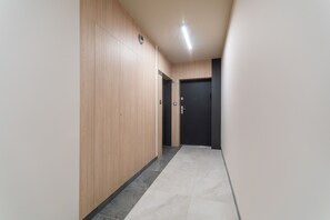 Departamento Deluxe | Área de sala de estar | Televisión de pantalla plana 