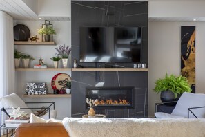 Smart TV, fireplace, foosball, books
