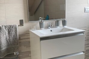 Hair dryer, bidet, towels, soap