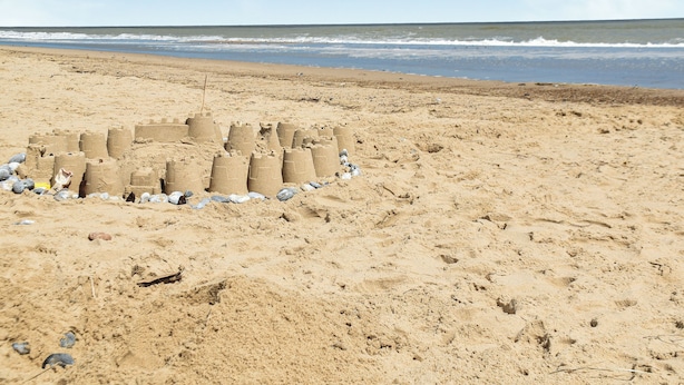 A sandy beach with a sandcastle structure. - 4 bedroom accommodation in Eccles on Sea (Eccles on Sea)