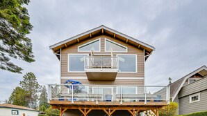 A two-story house with a balcony on the second floor. - Beautiful Birch Bay Retreat w/ Deck & Fire Pit! (Blaine)
