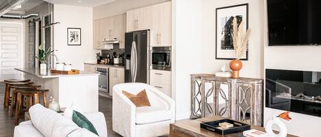 Condo, Multiple Beds, Patio, City View ((R06) 3198 Blake St. Unit 303) | Living area | TV, fireplace