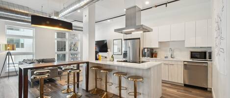 Condo, Multiple Beds, Patio, City View ((R04) 3198 Blake St. Unit 207) | Private kitchen | Fridge, microwave, oven, stovetop