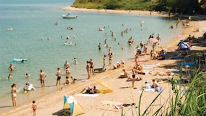 A crowded beach with people swimming and sunbathing. - Stunning home in Vrsi with sauna (Vrsi)