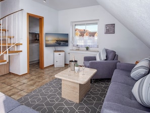 A modern apartment with a loft-style living area, a kitchen, and a dining space. - Schönfelder by Interhome (Norddeich)