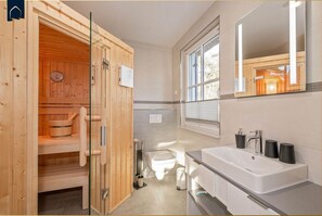 Shower, hair dryer, towels