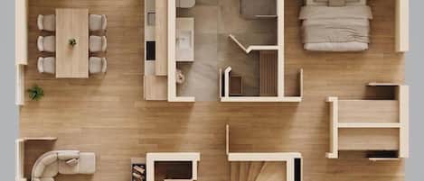 A floor plan of a hotel room with a bed, seating area, and a bathroom.