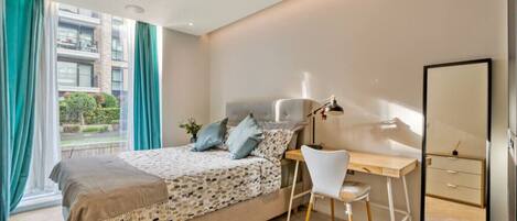 1 bedroom, desk, iron/ironing board, travel crib