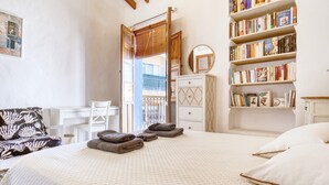 A bedroom with a bed, a bookshelf, a desk, and a chair. - Designer Country House Near the Sea (La Nucia)