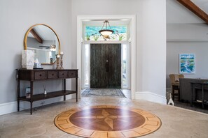 Welcoming foyer, complete with floor compass...you can't lose no matter which direction you choose!