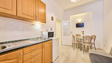 Fridge, microwave, cookware/dishes/utensils