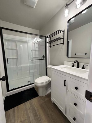 Shower, hair dryer, towels, soap