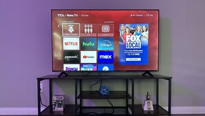A TCL Roku TV on a black TV stand with a shelf below. - Cozy Downtown, Montrose Studio!
Free parking ! (Houston)