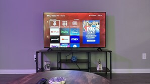 A living room with a flat-screen TV mounted on the wall, a wooden coffee table, and a remote control on the table. - Cozy Downtown, Montrose Studio!
Free parking ! (Houston)