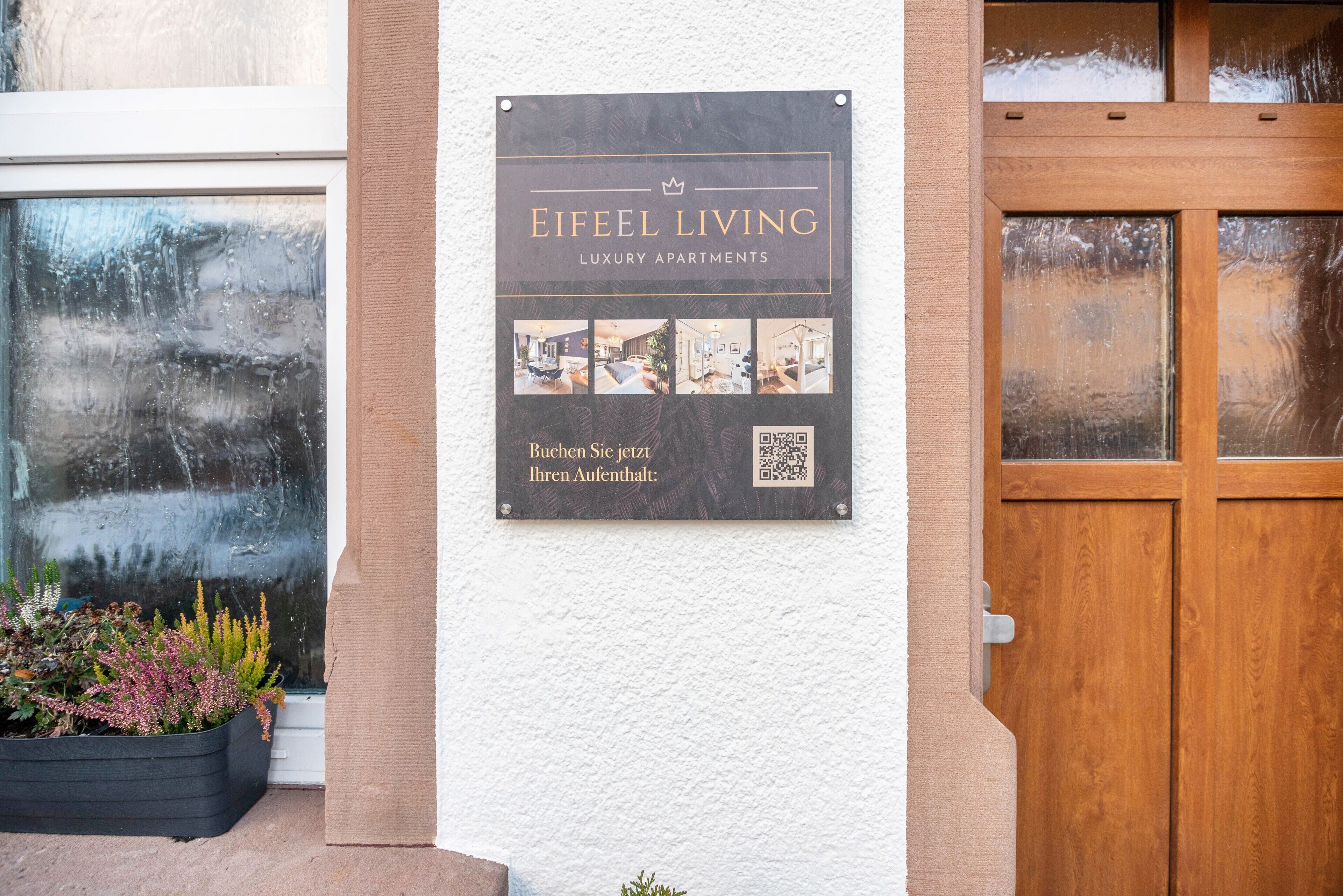 A sign for Eifeel Living Luxury Apartments with a QR code and photos of the interiors.