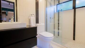 Shower, hair dryer, towels, shampoo