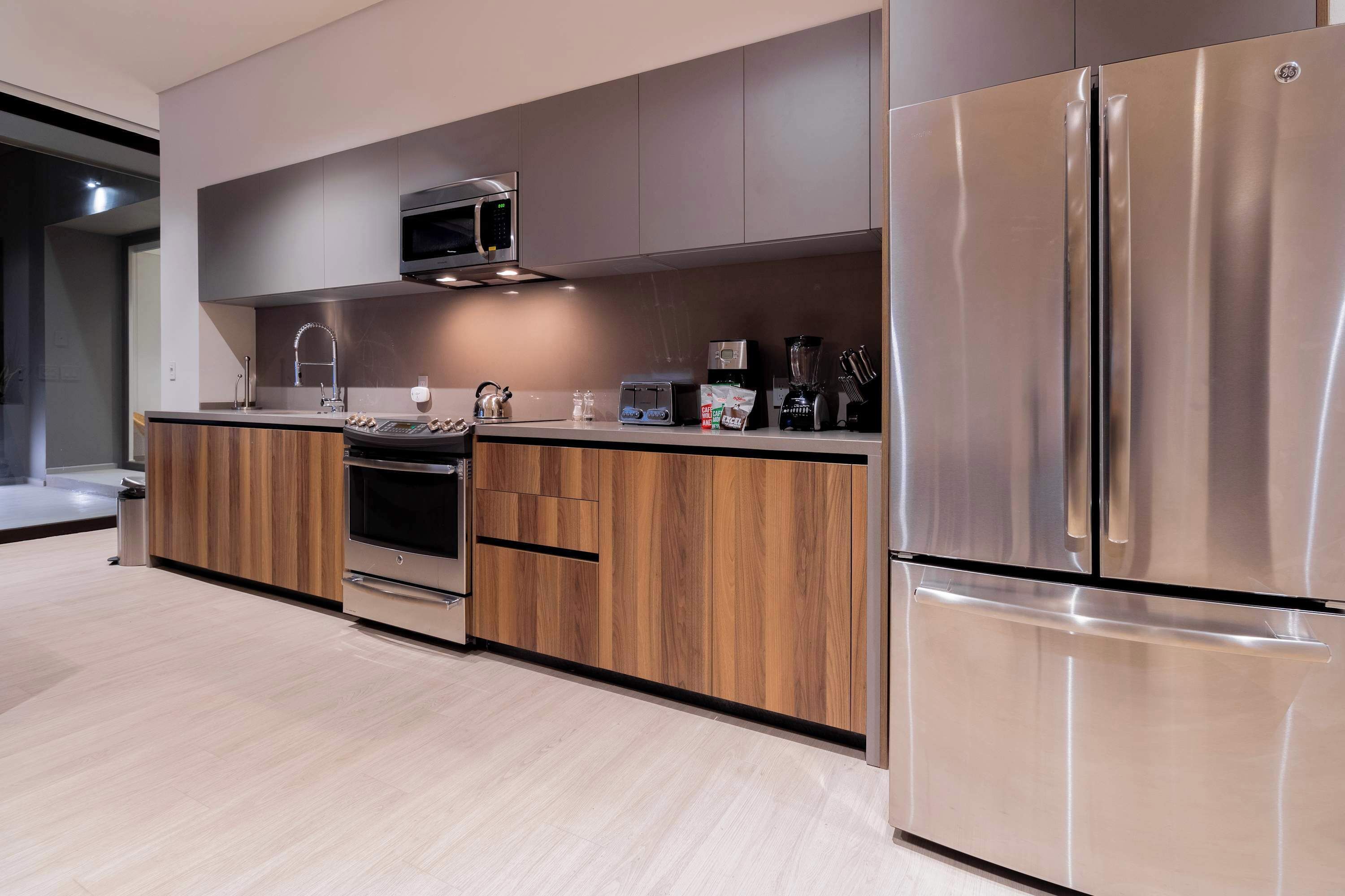 Fridge, microwave, stovetop, coffee/tea maker