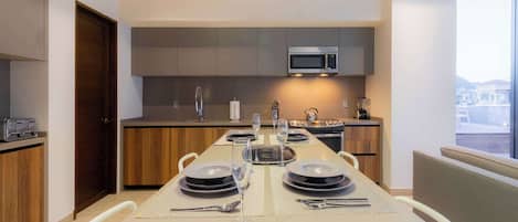 Fridge, microwave, stovetop, coffee/tea maker
