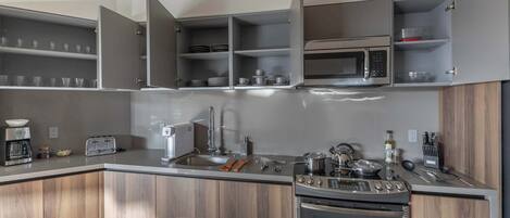 Fridge, microwave, stovetop, coffee/tea maker