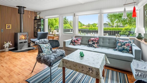 A cozy living room with a sofa, armchairs, a table, and a fireplace. - "Fridtjof" - 550m to the fjord by Interhome (Hemmet)