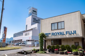 A building with a sign for 'Royal Fuji' and another sign for 'Bel Shopping Center'. - SEMINAR PLAZA ROYAL FUJI (Fujikawaguchiko)