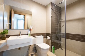 Family Apartment | Bathroom | Shower, hair dryer, slippers, towels