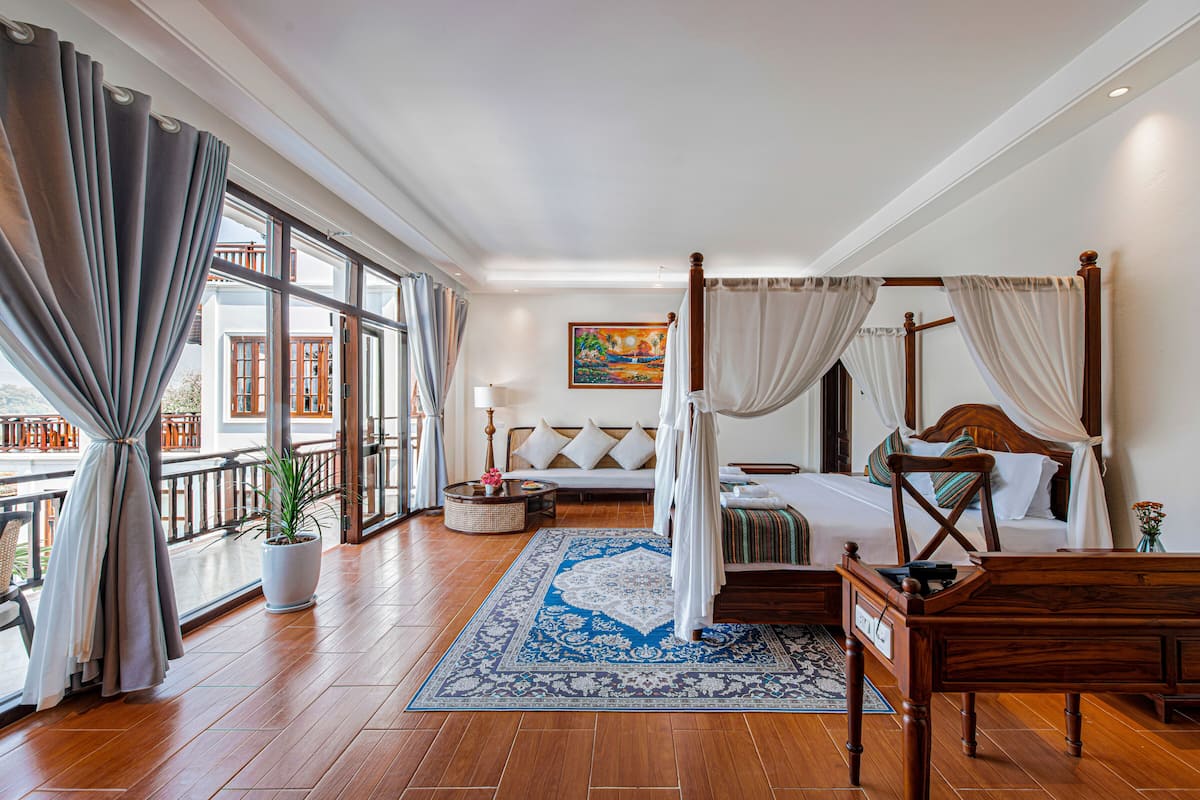 Deluxe Suite, Pool View | Living area | 52-inch Smart TV with cable channels, DVD player, pay films