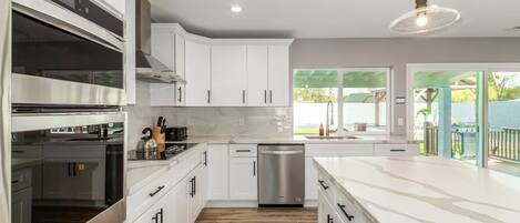 Coffee/tea maker, fridge, microwave, oven
