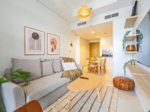 Deluxe Apartment | Living room - Modern and Cozy Condo With Unobstructed City Views (Dubai)