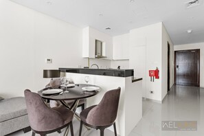 Dining room - WelHome - Charming Breathtaking 1BR Apt. In Damac Hills (Dubai)