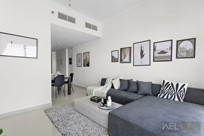 Deluxe Apartment, Balcony, City View | Living area - WelHome - Breathtaking 1BR Apt with Balcony and City View (Dubai)