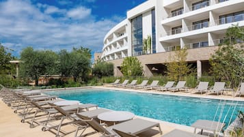 Seasonal outdoor pool, pool umbrellas, pool loungers