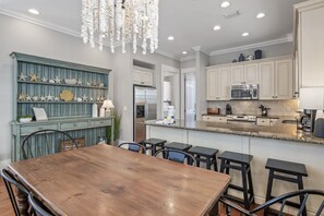 A modern kitchen with white cabinets, a stainless steel refrigerator, and a granite countertop. - Cozy 3BR Beach Home, Pool & Beach Access ~ Blue Lagoon, Seacrest Beach 30A (Panama City Beach)