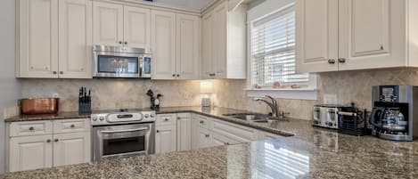 Coffee/tea maker, fridge, microwave, oven