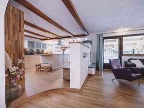 Deluxe Apartment, Mountain View | Living area | 50-inch Smart TV with cable channels - Appartements Enzian by we rent (Rauris)