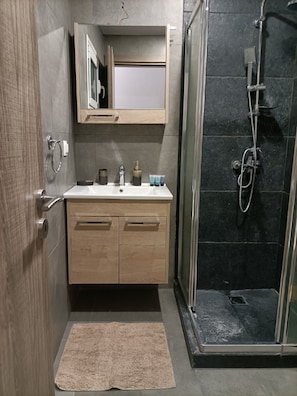 Shower, hair dryer, towels, soap