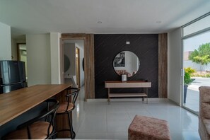Enjoy a meal at the dining table with four chairs, or relax by the window with a view of the outdoors.