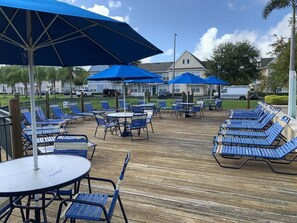 Outdoor dining - 4BR Near Disney | 4 Pools, Arcade, Movie Theater (Kissimmee)
