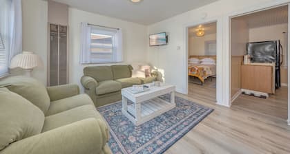 Walk to the beach or Sunset Lake with a front yard and Pet-Friendly!