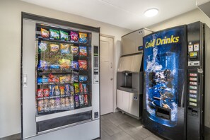 A vending machine with snacks and a cold drink dispenser.