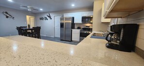 Fridge, microwave, oven, stovetop - Bay House 4 bedroom 3 full bath

 (Orange)