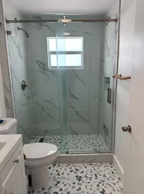 Shower, hair dryer, towels, soap