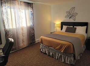 Deluxe Queen Room Single Use, Courtyard View | Individually furnished, desk, laptop workspace, free WiFi - Grizzly Motel (Swan Hills)