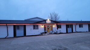 A single-story building with a sign reading "OFFICE" at the entrance.
